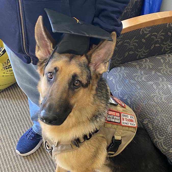Veteran Chad Leaver with his service dog Cote graduated Pawsitive for Heroes