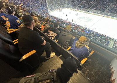 Stadium filled with people watching a hockey game